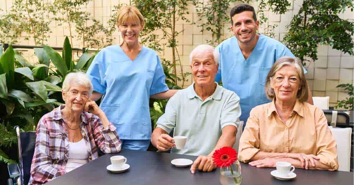 Support networks for caregivers and seniors in Pennsylvania as professional caregivers and seniors share time together in a safe outdoor community setting.