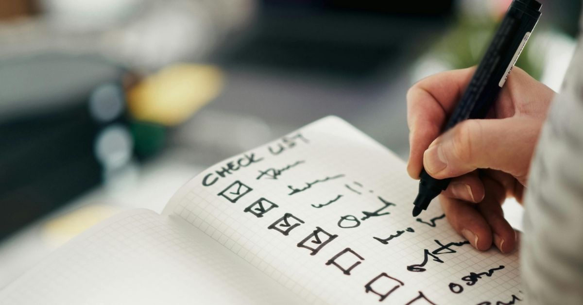 Home care planning checklist being written to organize in-home care tasks and support services.